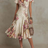 Joanna | Vestido midi satinado con flores de estilo vintage